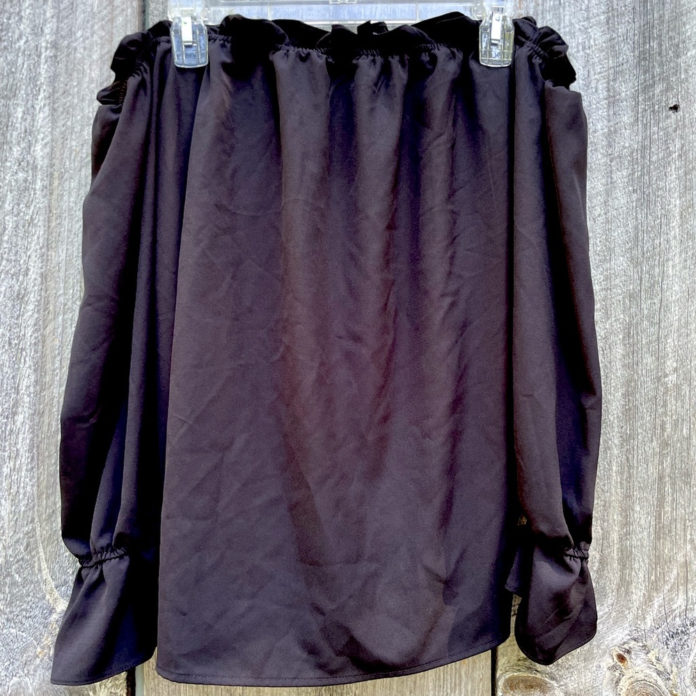 Off the shoulder flowy shirt.
